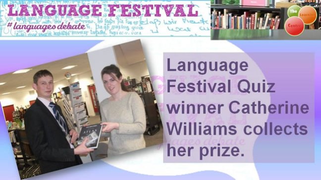 The winner of the Language Festival Quiz collects her prize.