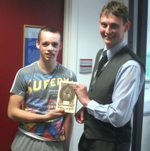Ben being presented with his prize