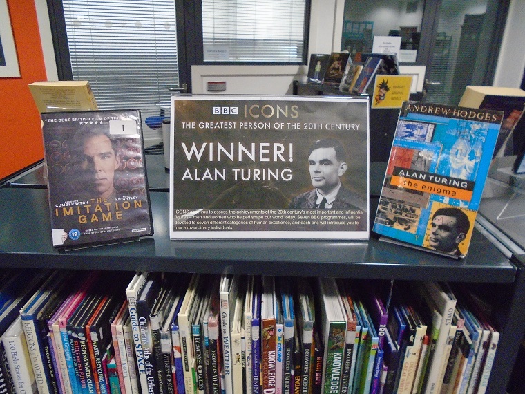 Shelf top display for the BBCs Icons, 'The Greatest Person of the 20th Century', winner Alan Turing. Including the DVD 'The Imitation Game' and Andrew Hodges' book 'Alan Turing the Enigma'.
